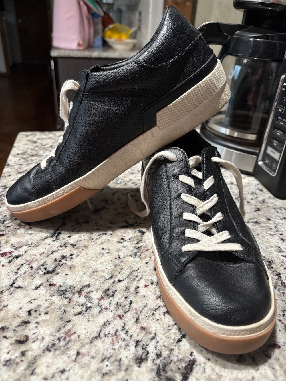 Women’s Dolce Vita black sneakers.